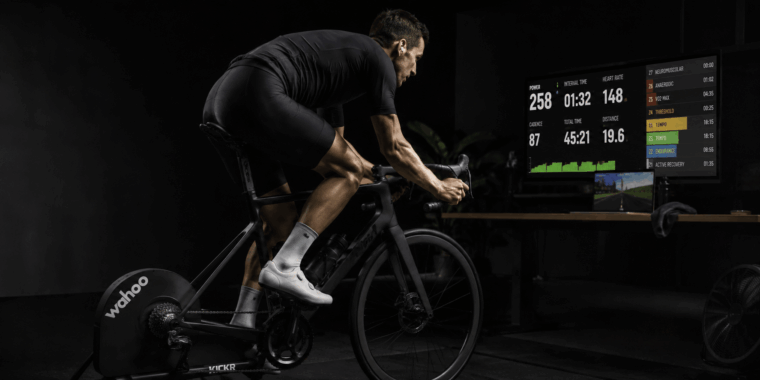 Cyclist training on a Wahoo KICKR smart trainer with power data on screen
