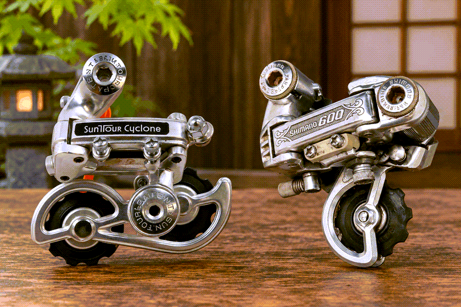 Vintage SunTour Cyclone and Shimano 600 Arabesque rear derailleurs side by side